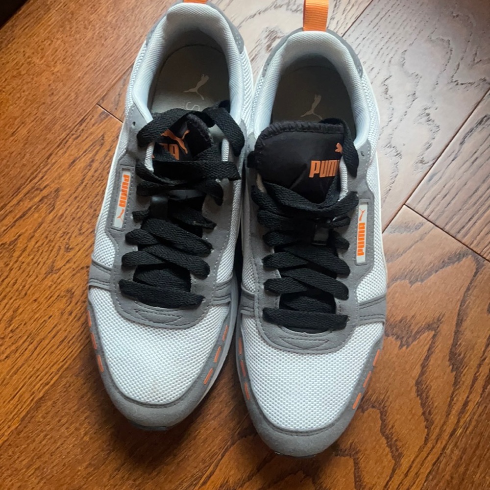 Puma sneakers. Men’s size 10.5. Neutral colors with a hint of orange.